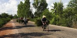 crw_7241 Villagers carrying thatch on their bicycles to the market. We also saw villagers carrying large numbers of coconuts (> 20) on their bicycles but I didn't manage to get a picture of that.