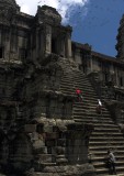 crw_6309 Birds circling above locals climbing up the steep stairway to the third level of Angkor Wat.