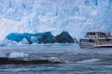 crw_4198 A massive ice chunk (the deep blue piece in front) had just calved off the glacier. Fortunately for the boat, the chunk was near the waterline so the wave (foreground) wasn't very large.