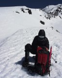 crw_5782 Paul stowing his gear at 9200 ft. Casaval Ridge is in the background.