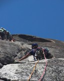 crw_5762 Chris waiting at a solid stance on near the top of the third pitch while waiting for the human traffic jam to clear at the belay station for the fourth pitch.