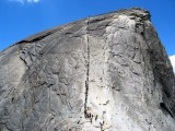 2004yosemite0015 The cables leading up Half Dome filled with people.