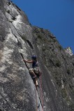 crw_5757 Chris hand jamming up the crack with perfect clear blue skies. In the background, Danielle and another party are at the end of the third pitch.